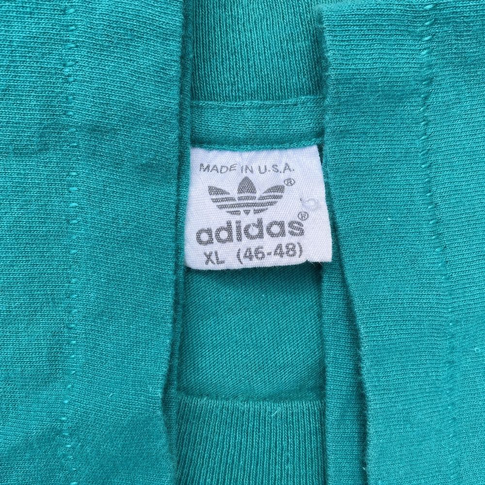Adidas Equipmentの実物タグ資料、ケア表示やサイズ欄を含むタグ周辺