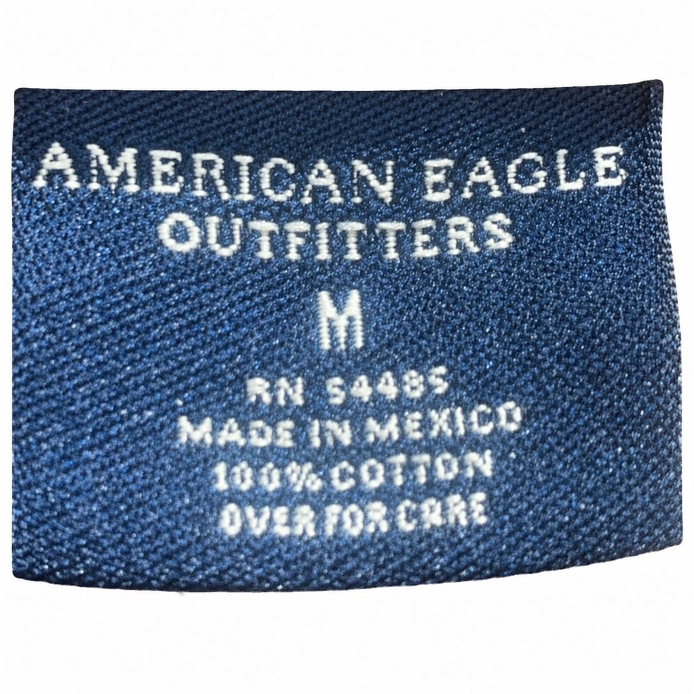 AMERICAN EAGLE OUTFITTERS、MADE IN PAKISTAN、RN 54485、CA 03873、100パーセントCOTTON表示のタグ