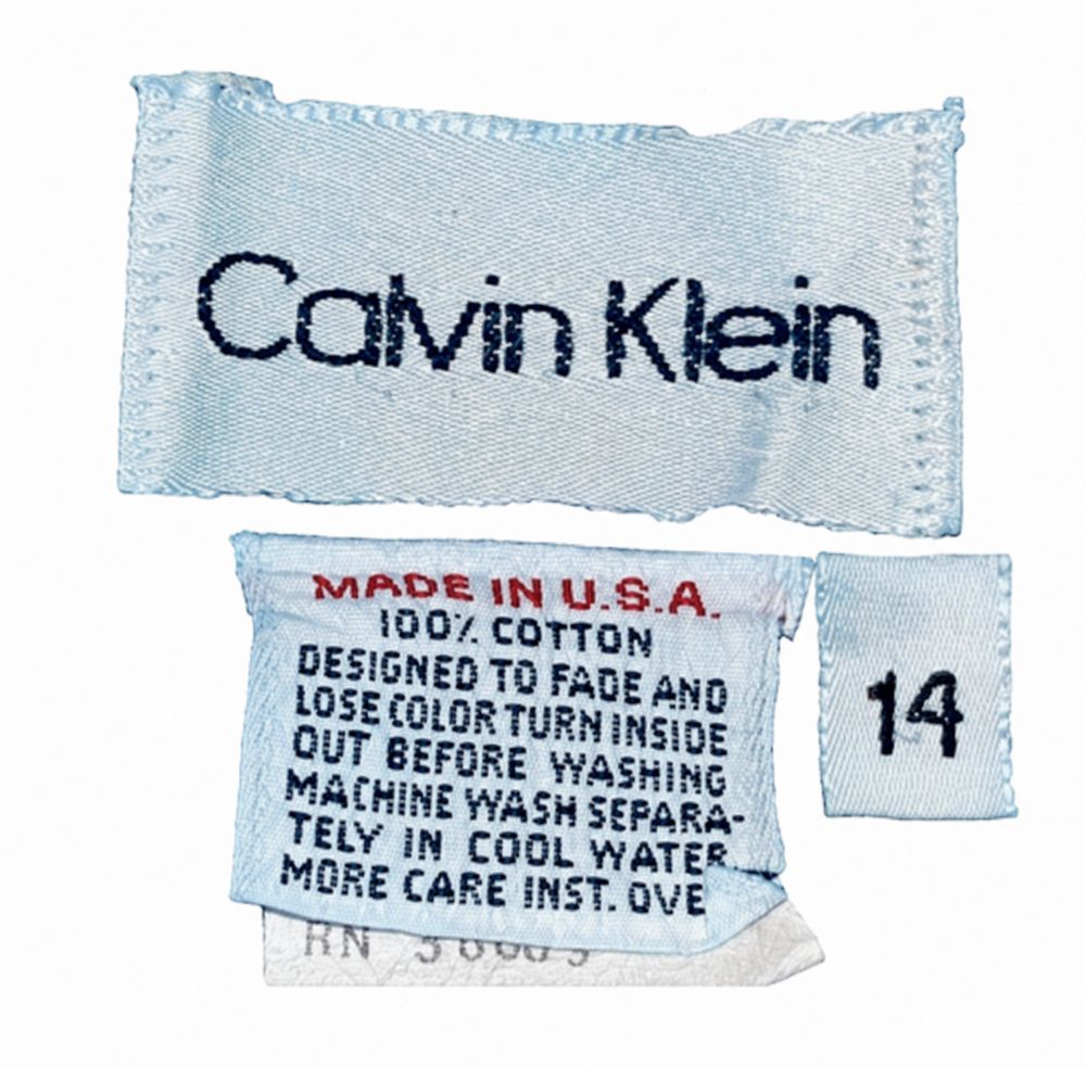 Calvin Klein Jeansの白タグとMade in U.S.A.、100パーセントコットン、サイズ14表示