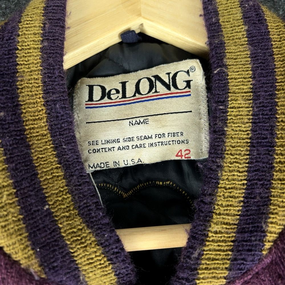 DeLONGの実物タグ資料、ケア表示やサイズ欄を含むタグ周辺