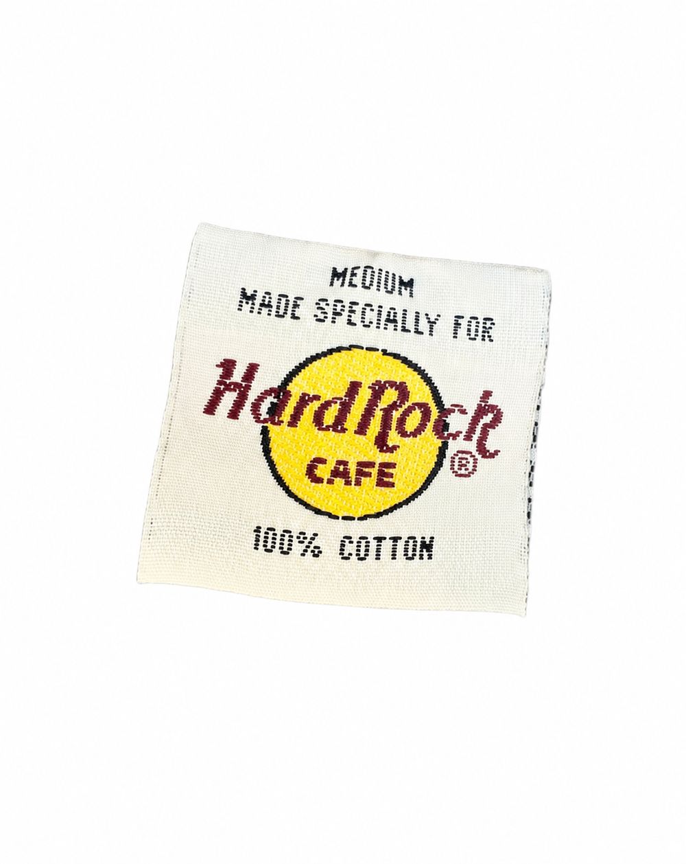 MEDIUM MADE SPECIALLY FOR Hard Rock Cafe、ASSEMBLED IN MEXICO OF U.S. COMPONENTSとフランス語表示のタグ