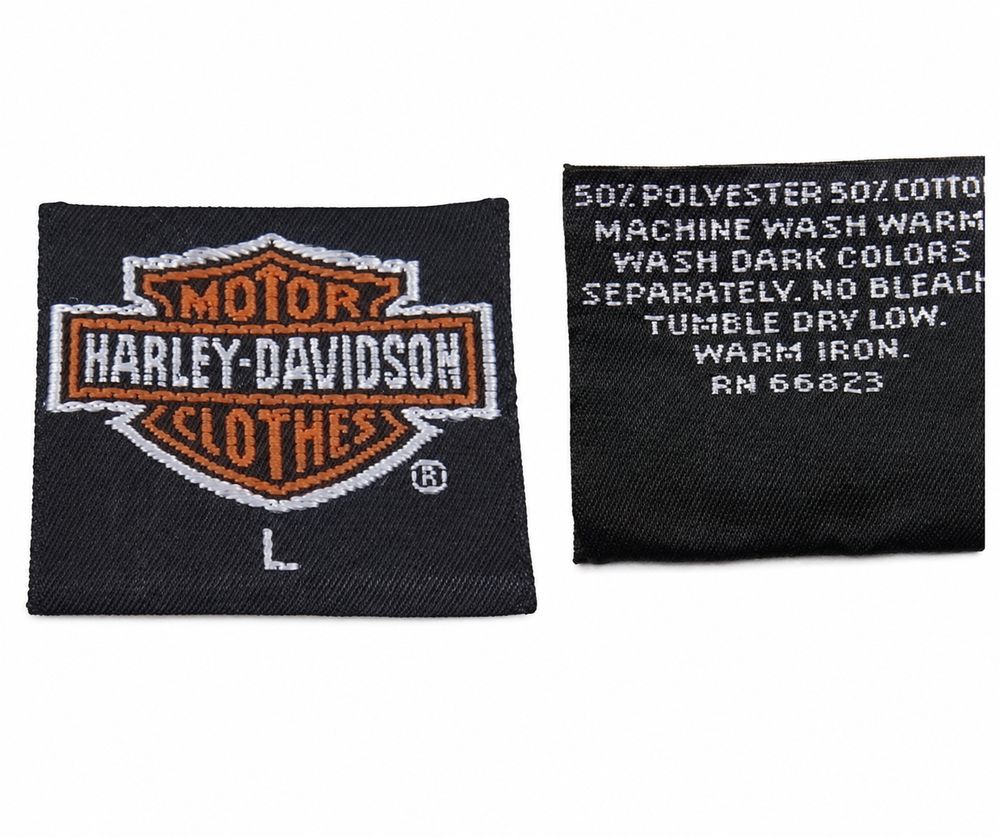 MOTOR HARLEY-DAVIDSON CYCLES、An American Legend、100パーセントCotton、Made in Canada、CA 03402のデニムタグ