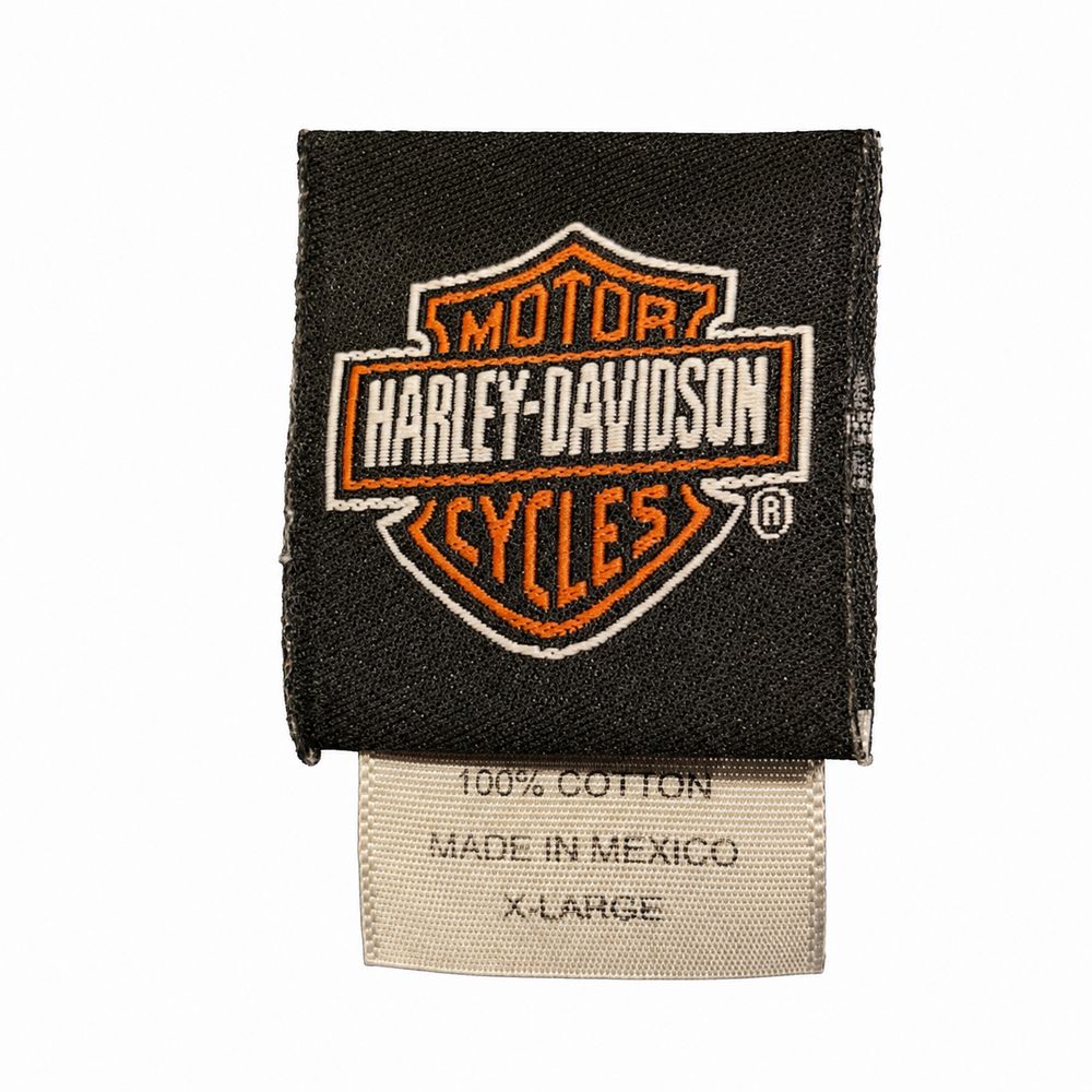 An American Legend、100パーセントCotton、Made in Canada、CA 03402のデニムジャケットタグ