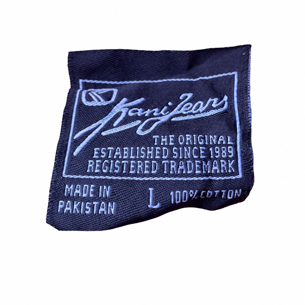 Kani Jeans、Since 1989、Established 1989、Reg. Trademark、XXLとケア表示のタグ