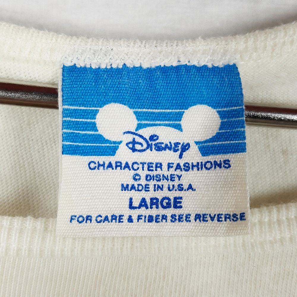 Mickey Mouseの実物タグ資料、色の違うボディに付く同ブランドのタグ