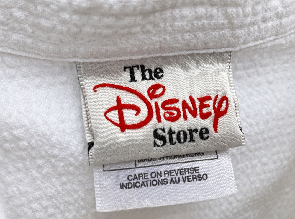 Mickey Mouseの実物タグ資料、ケア表示やサイズ欄を含むタグ周辺