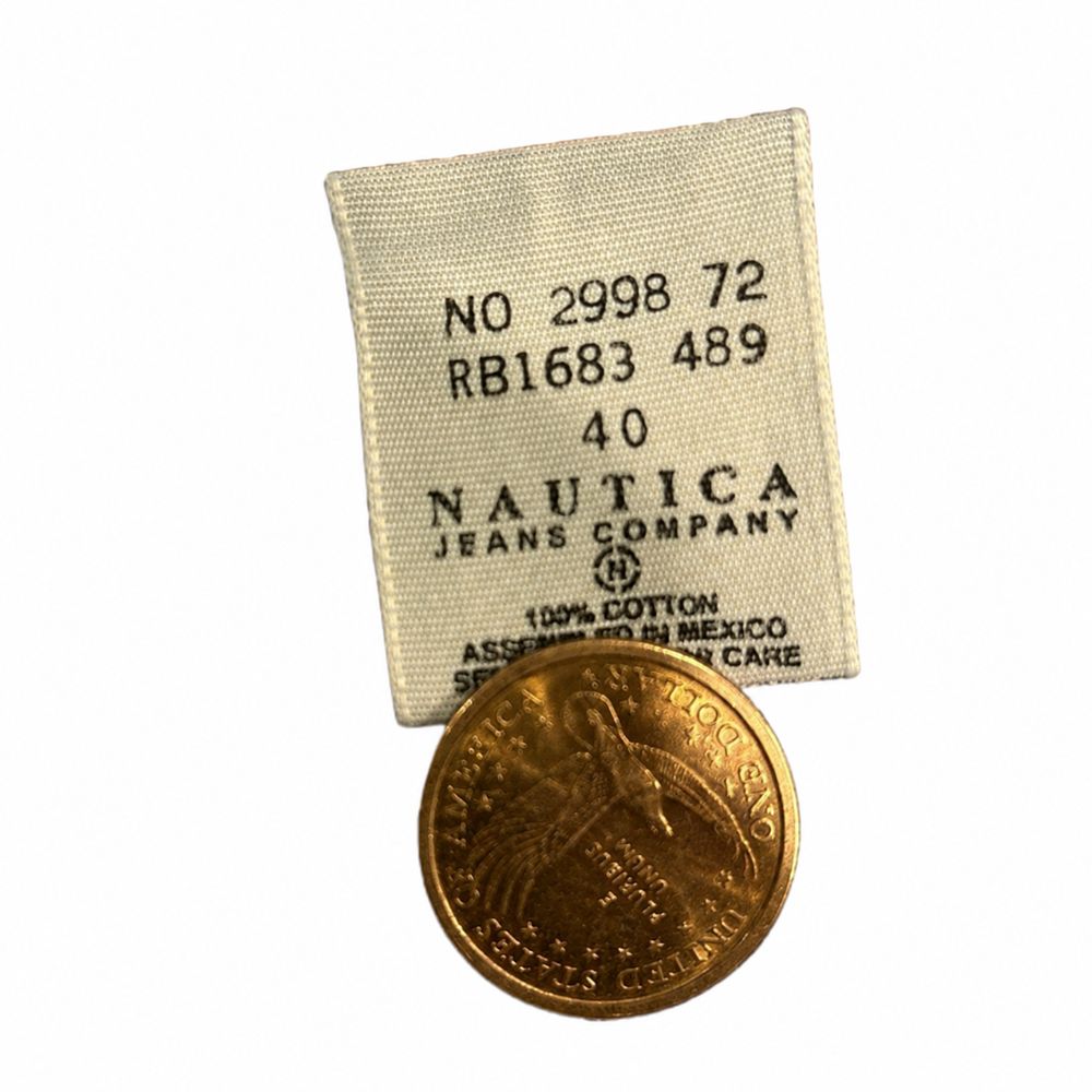 NAUTICA JEANS COMPANYのタグとXL、100パーセントコットン、Made in Mexico表示