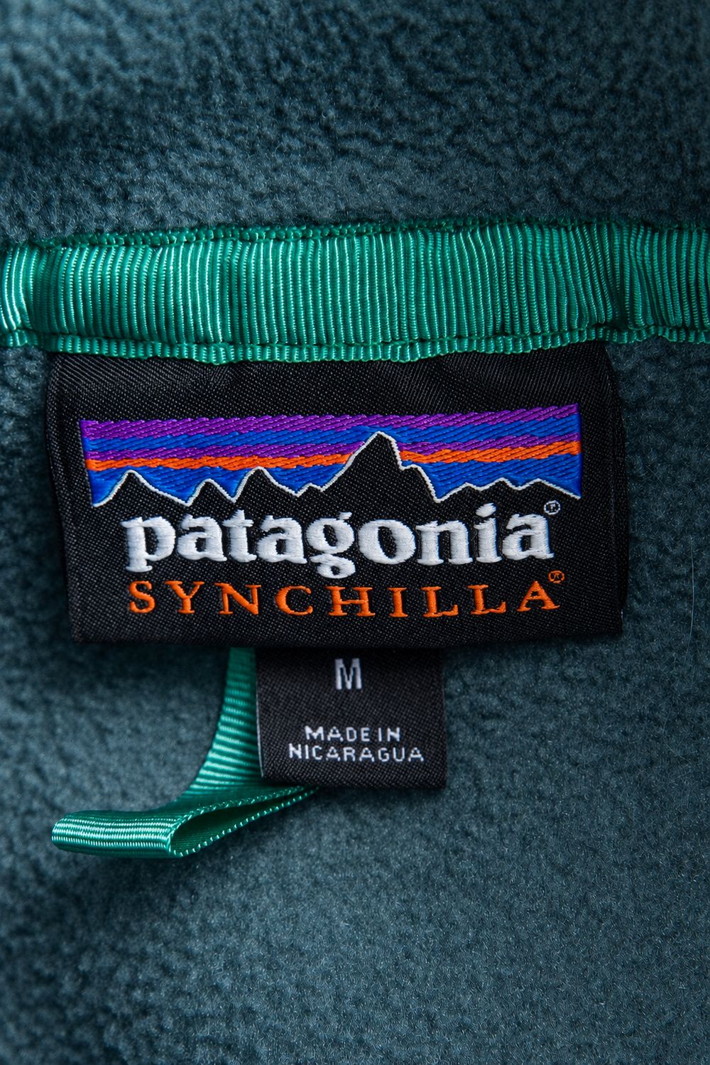 Patagonia Synchillaの実物タグ資料、ケア表示やサイズ欄を含むタグ周辺