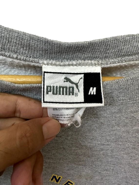 PUMAの実物タグ資料、ケア表示やサイズ欄を含むタグ周辺