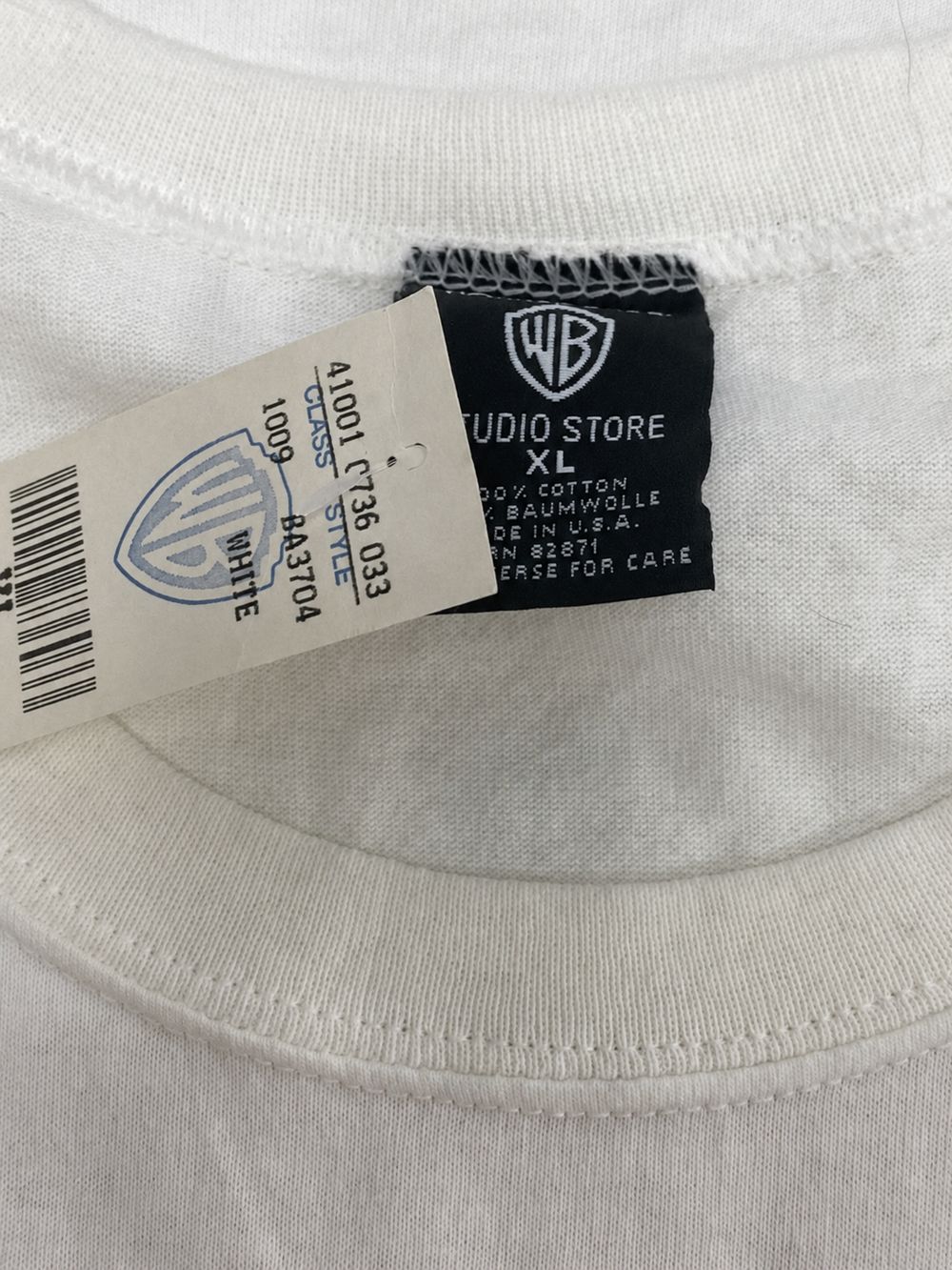 Warner Bros.の実物タグ資料、別仕様の織りネーム。縫い付け方にも注目する